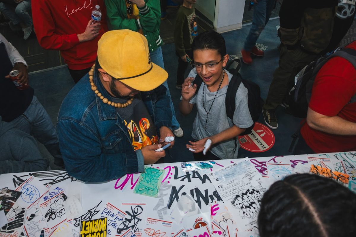 Families in the crowd at Hip-Hop Summit Denver